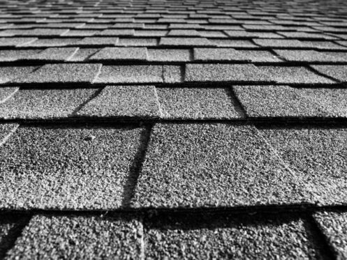 close up of roof shingles black and white, the dangers of DIY roofing in Maryland